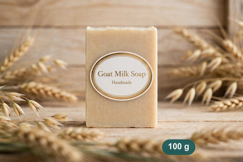 Goat milk soap bar standing on wood with wheat ears