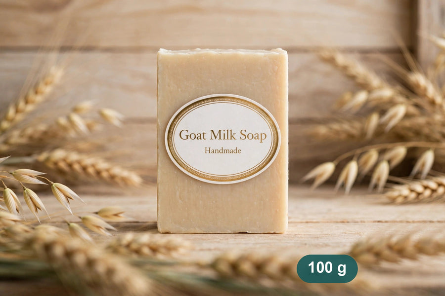 Goat milk soap bar standing on wood with wheat ears