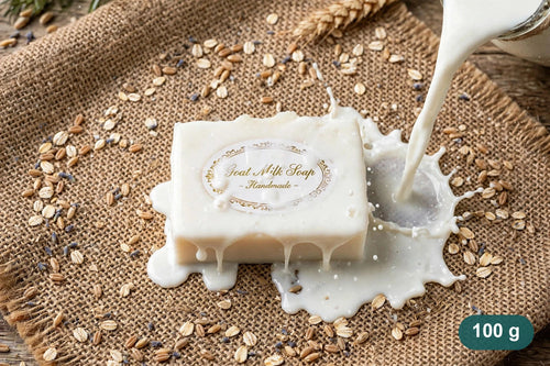 Klyvaa Bath goat milk soap bar, 100 g, with milk pouring over it on burlap